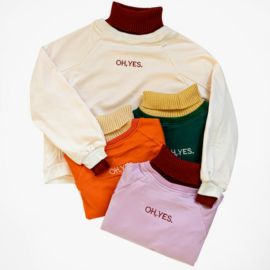 a group of sweaters sitting on top of each other
