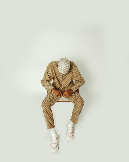 A man in a suit sitting on a bench