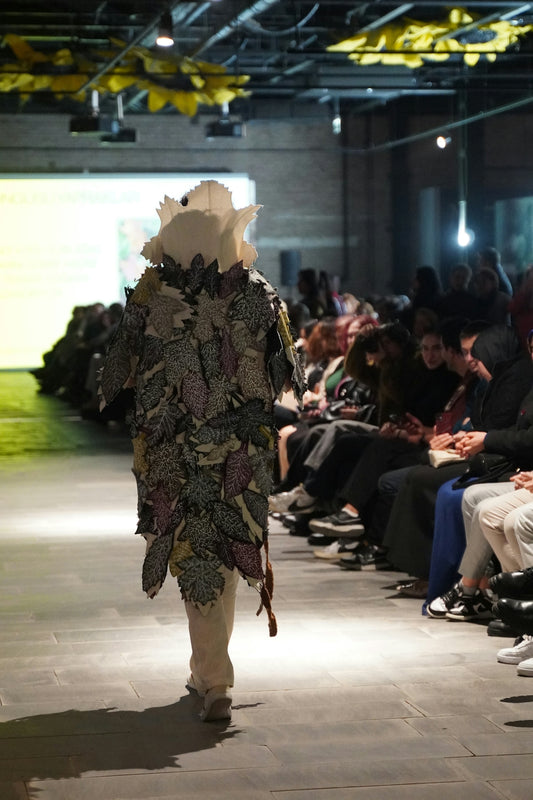 A model walks the runway during a fashion show.