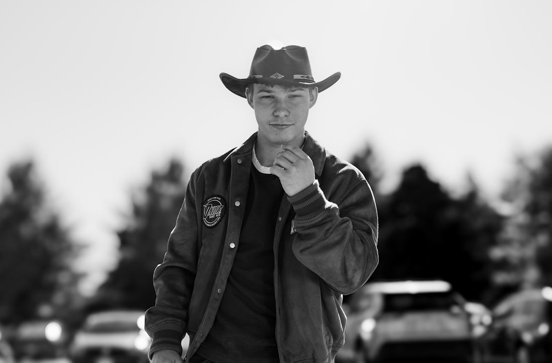 Young man in cowboy hat outdoors