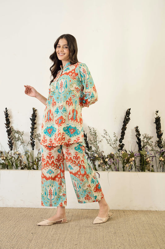 Woman in patterned pajama set smiles